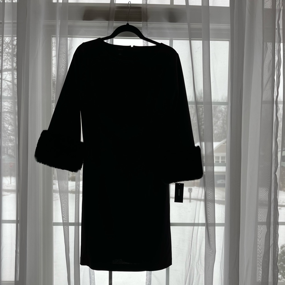 New, designer, little black dress with faux fur cuffs. Elegant & flattering.